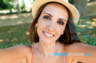 Pretty Young Girl Taking Selfies With Her Smart Phone In The Gar… Stock Photo