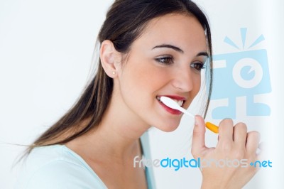 Pretty Young Woman Brushing Her Teeth Stock Photo