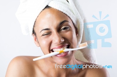 Pretty Young Woman Brushing Her Teeth Stock Photo