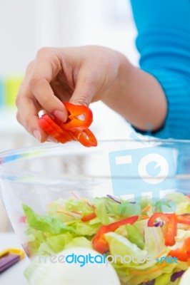 Pretty Young Woman Cooking At Home Stock Photo