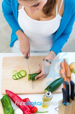 Pretty Young Woman Cooking At Home Stock Photo