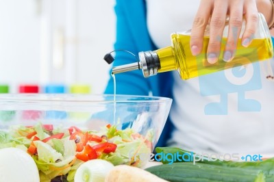 Pretty Young Woman Cooking At Home Stock Photo