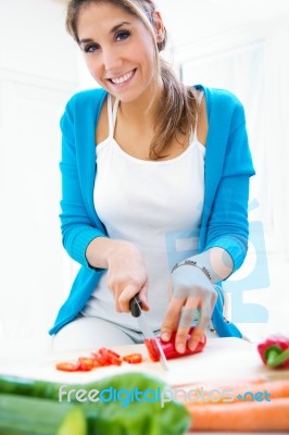 Pretty Young Woman Cooking At Home Stock Photo