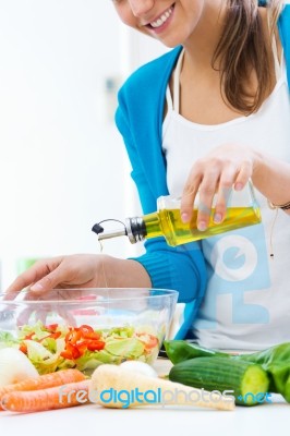 Pretty Young Woman Cooking At Home Stock Photo