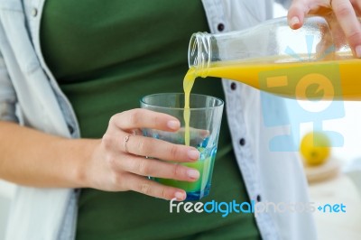 Pretty Young Woman Enjoying Breakfast In The Kitchen Stock Photo