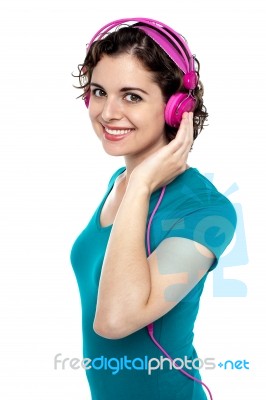 Pretty Young Woman Enjoying Music Stock Photo