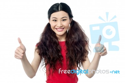 Pretty Young Woman Giving Good Wishes Stock Photo