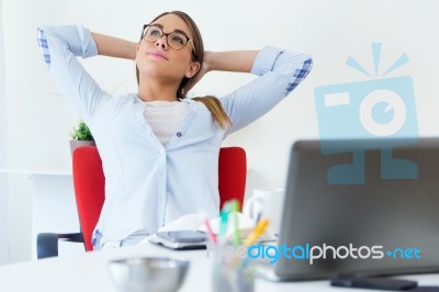 Pretty Young Woman Relaxing One Moment In Her Office Stock Photo