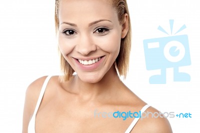 Pretty Young Woman Smiling Warmly Stock Photo