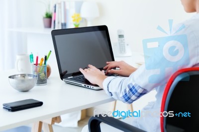 Pretty Young Woman Using Her Laptop In The Office Stock Photo