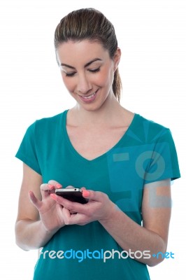 Pretty Young Woman Using Smartphone Stock Photo