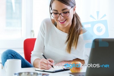 Pretty Young Woman Working In Her Office Stock Photo