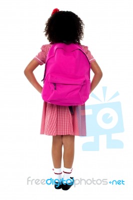 Primary School Girl Facing Wall Stock Photo