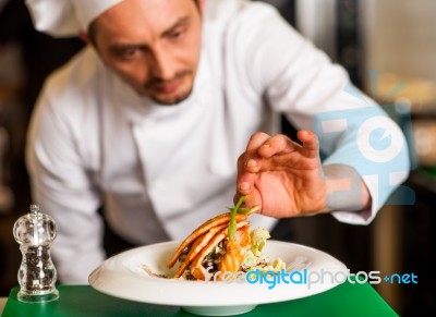 Professional Chef Preparing Baked Salmon Stock Photo