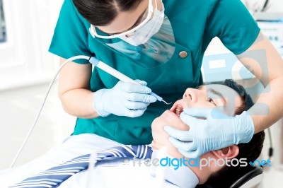 Professional Dentist Doing Teeth Checkup Stock Photo