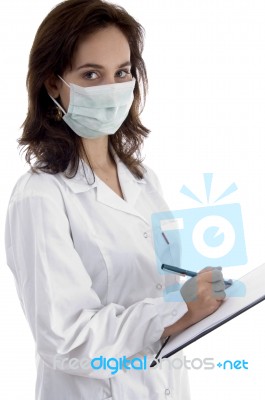 Professional Lady Doctor Note Down Medical Prescription Stock Photo