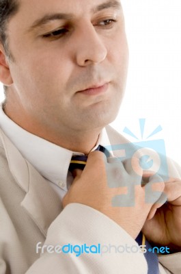 Professional Man Adjusting His Tie Stock Photo