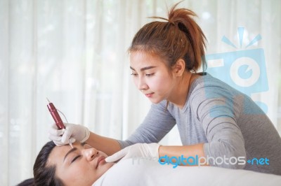 Professional Permanent Makeup Applying Stock Photo