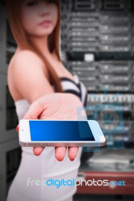 Programmer And Smart Phone In Data Center Room Stock Photo