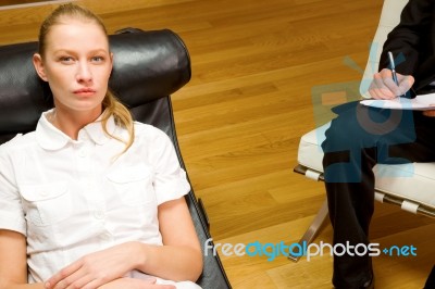 Psychiatrist Examining A Female Patient Stock Photo