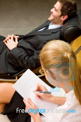 Psychiatrist Examining A Male Patient Stock Photo