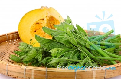 Pumpkin And Leaf  On Wicker Tray Isolated Stock Photo