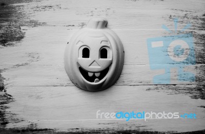 Pumpkin Mask On Wooden Floor Background For Halloween Stock Photo