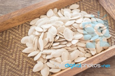 Pumpkin Seeds On Wooden Tray Stock Photo