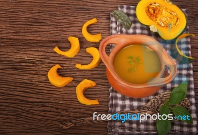 Pumpkin Soup In Clay Pot With Fresh Pumpkins Stock Photo