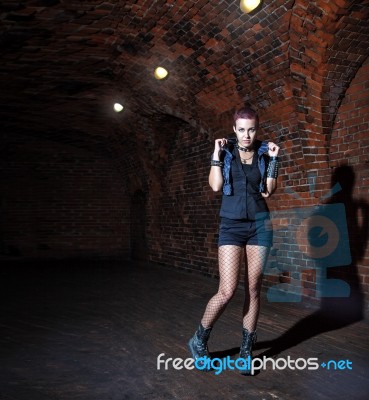 Punk Girl Standing In The Dark Corridor Stock Photo