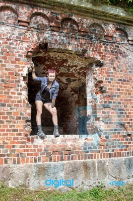 Punk Girl Standing In The Window Stock Photo