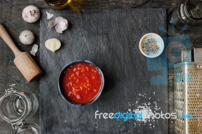 Pureed Tomatoes In A Ceramic Dish On A Table Stock Photo