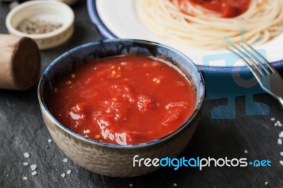 Pureed Tomatoes In A Ceramic Dish On A Table Stock Photo