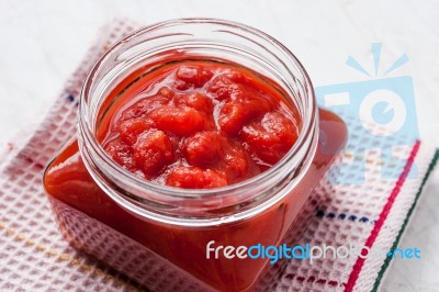 Pureed Tomatoes In A Glass Jar Stock Photo