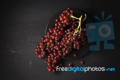 Purple Grapes Still Life On Black Background Stock Photo