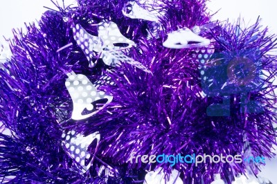 Purple Holiday Decoration Ribbon On White Background Stock Photo