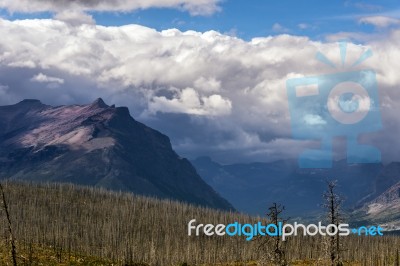 Purple Mountains Next To Lower Two Medicine Lake Stock Photo