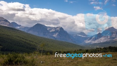 Purple Mountains Next To Lower Two Medicine Lake Stock Photo