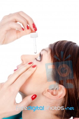 Putting Drops In Eye Stock Photo