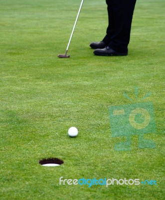 Putting Golf Ball Stock Photo