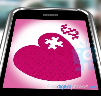 Puzzle Heart On Smartphone Showing Commitment Stock Image