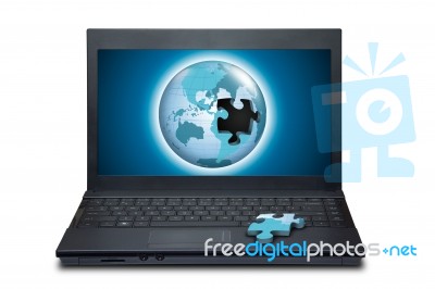 Puzzle World On Laptop Stock Photo