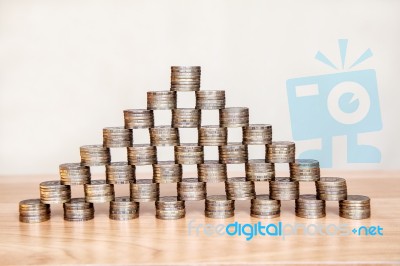 Pyramid Of The Coins On The Table Stock Photo