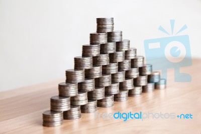 Pyramid Of The Coins On The Table Stock Photo