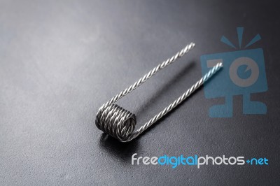 Quad Coil For Vaping On A Black Background Stock Photo