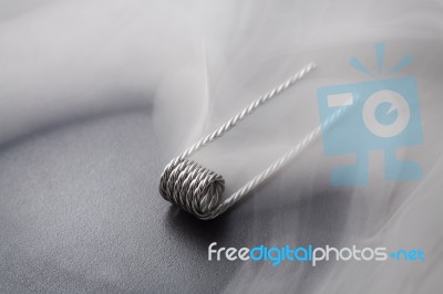 Quad Coil For Vaping On A Black Background Smoke Stock Photo