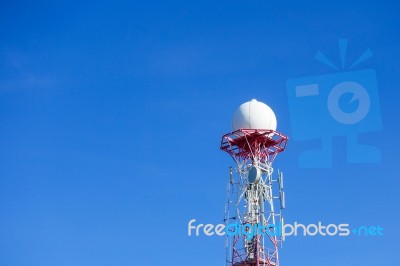 Radar Dome In The Sea With Blue Sky And Clouds Stock Photo