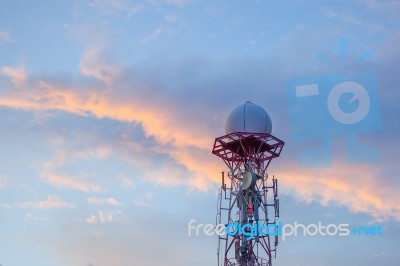 Radar Dome In The Sea With Blue Sky And Clouds Stock Photo