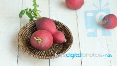 Radishs In Basket On White Background Stock Photo