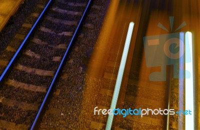 Railway Lines One Side Speeding Train Lights The Next Stock Photo